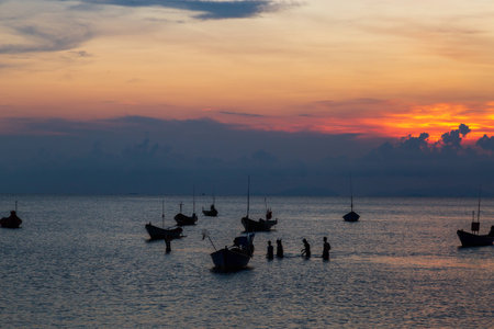 Sunset at the sea and boat with copy space at Chao Lao Beach, Chanthaburi Province, Thailand.の写真素材