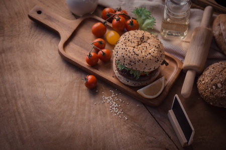 Hamburger homemade on wood table with copy space.の写真素材