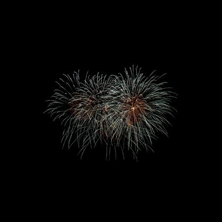Beautiful display of colorful fireworks on a night sky background. isolated on black background.の写真素材