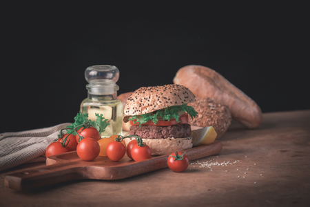 Hamburger homemade on wood table with copy space.の写真素材