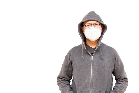 Asian middle age man Asia ethnic wearing health mask to prevent virus or flu or covid19 or coronavirus and white background copy space. Clipping path in the picture.の写真素材