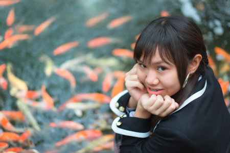 Asian teenage girls Asia ethnic wearing Japanese school uniform Look at the camera and smiling. The...