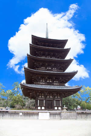 Old five-storied pagoda made wood at Kofuku Temple, Nara Prefecture, Japan The background is sky and cloud. Is a vertical image.のeditorial素材