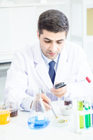 Male and Female Scientists or doctor are trying to find a vaccine against germs Such as the corona virus or COVID 19 in a laboratory.の写真素材