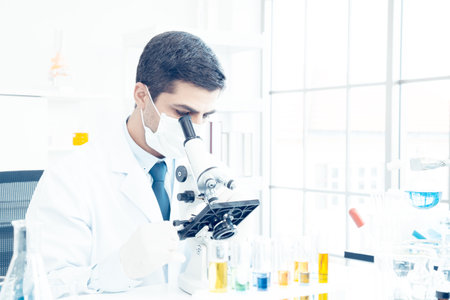 Male Scientists or doctor are trying to find a vaccine against germs Such as the corona virus or COVID 19 in a laboratory.の写真素材