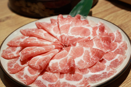 Experience the culinary allure of mouthwatering cuisine. Indulge in the visual feast of delicious sliced pork, shabu, and hot pot delights. Let your taste buds embark on a flavorful journey.の写真素材