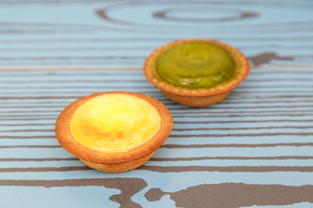 Egg tart and Steamed custard tart on a wood with copy space.の写真素材