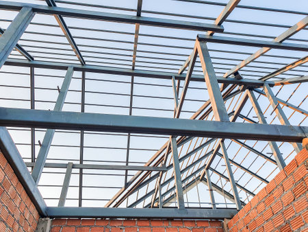 House construction site Use red bricks as a wall. With steel roof frame Concrete pillar.の写真素材