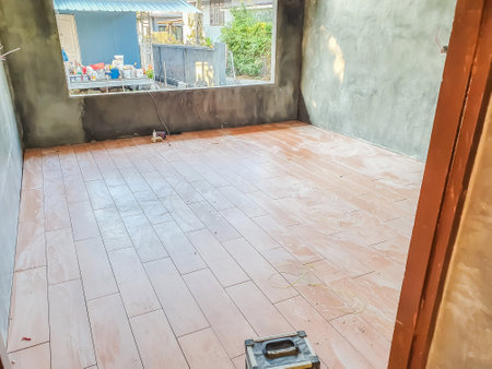 The new house is covered with red ceramic tiles with wooden patterns.の写真素材