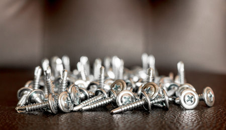 metal screws closeup on brown leather.