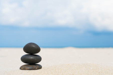 Stones balance, pebbles stack on the sand beachの写真素材