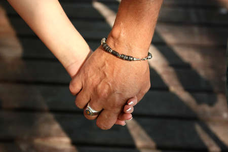 Man and female hand photographed by the close upの写真素材