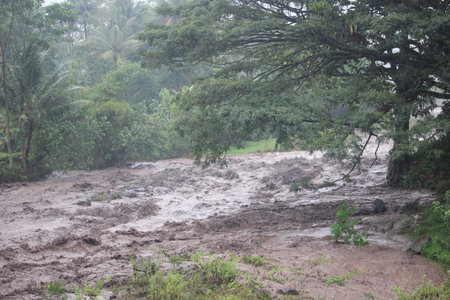 brown flood water from the summit of Mount Semeru , Bromo Tengger Semeru Park, Indonesia