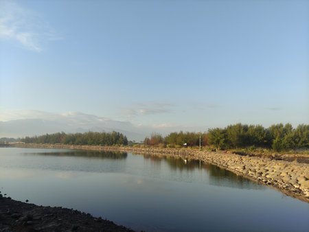 calm sea water suitable for harbor with views of seafront hillsの写真素材
