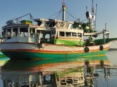 colorful fishing boats anchored in the harbor on Paiton beach Indonesia