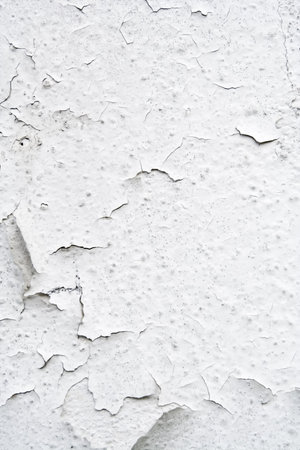 Vertical composition of cracked Obsolete white wall