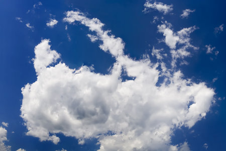 One fluffy cloud view from belowの写真素材