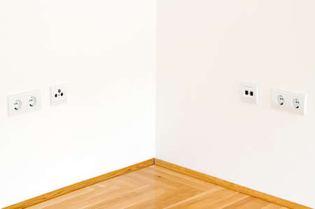 Symmetric view of simple white corner wallの写真素材