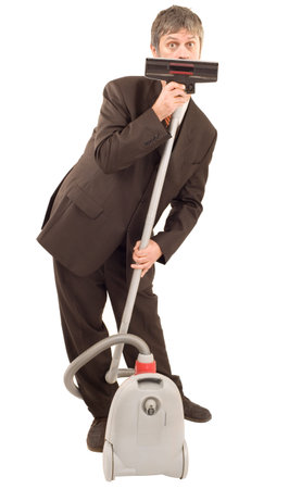 Businessman speak through vacuum cleaner isolated on white backgroundの写真素材