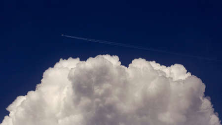 Airplane Flying Over the Cloudの写真素材