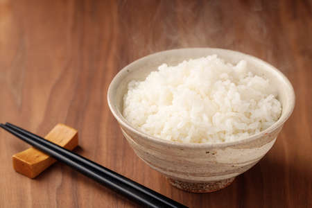 Rice with wood grain backgroundの写真素材