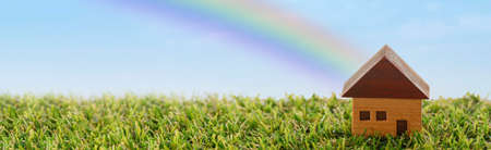 House, lawn and rainbowの写真素材