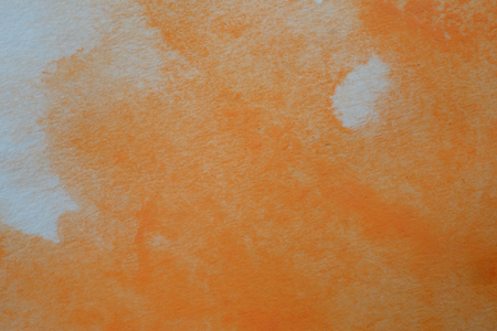 Abstract hand painted orange watercolor splash on white paper background, Creative Design Templatesの写真素材