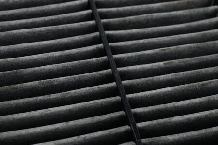 Cabin car with a dirty carbon air filter,spare part on a white backgroundの写真素材