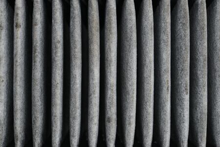 Cabin car with a dirty carbon air filter,spare part on a white backgroundの写真素材