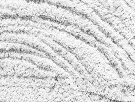 White soft cotton sheep wool fluffy fur carpet texture backgroundの写真素材