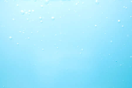 Abstract blue water splash wave surface with on white backgroundの写真素材