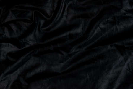 Black abstract background cloth and luxury liquid waves  silk texture satin materialの写真素材
