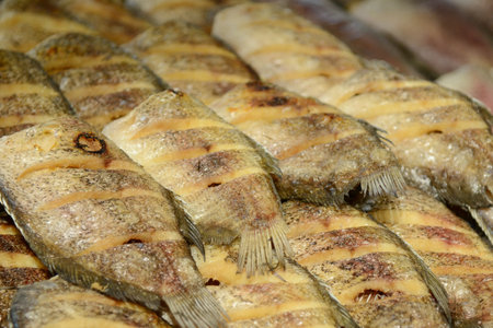 Fried fish in the market, close-up of a fishの写真素材