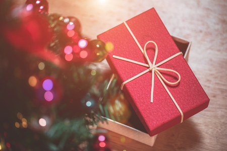 Christmas and New Year's Day, Top view red gift box decorated with ribbon and decoration christmas tree.の写真素材