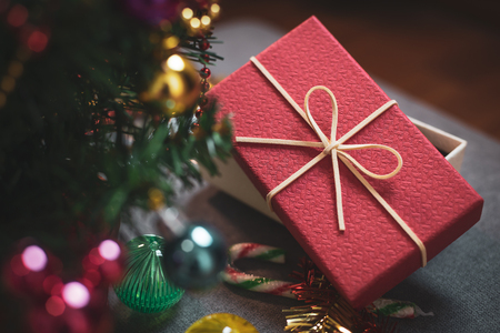 Christmas and New Year's Day, Top view red gift box decorated with ribbon and ribbon and decorated christmas tree.の写真素材