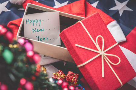 New Year and Christmas holiday, Close up greeting card paper with colorful gift box laid out as a background. Winter holidays.の写真素材