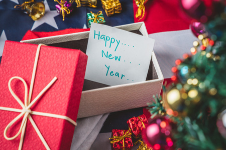 New Year and Christmas holiday, Close up greeting card paper with colorful gift box laid out as a background. Winter holidays.の写真素材