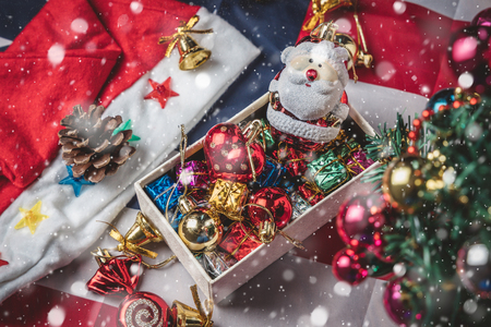 New Year and Christmas holiday, Close up Santa shaped dolls with colorful gift boxes placed in the background. Winter holidays.の写真素材