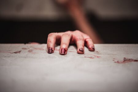 Bloody hands in the dark, Close up hand that feels painful and lonely with suffer from depression. Horror theme.の写真素材