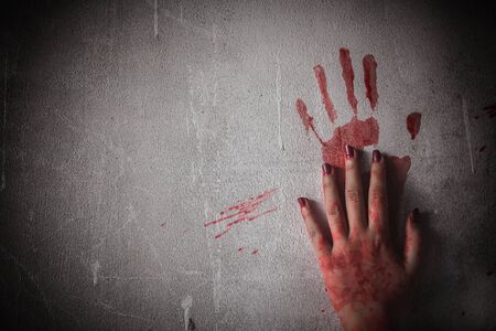 Nightmares of scary fear at the halloween festival. Bloody hands placed on a solid wall, Horror and terror.の写真素材