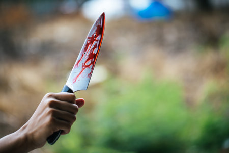Social violence and insecurity - Knife with blood stains scattered on the background, murder and...