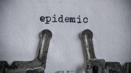epidemic text typed on blank sheet with an old typewriter in vintage background