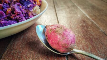 image of sweet potato on spoon backgroundの写真素材