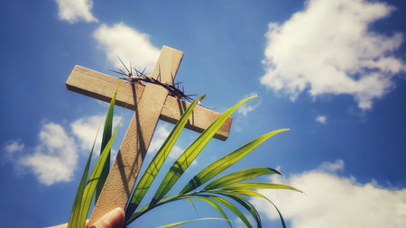 Lent,Holy Week and Good Friday concepts - photo of wooden cross raise up with sky backgroundの写真素材