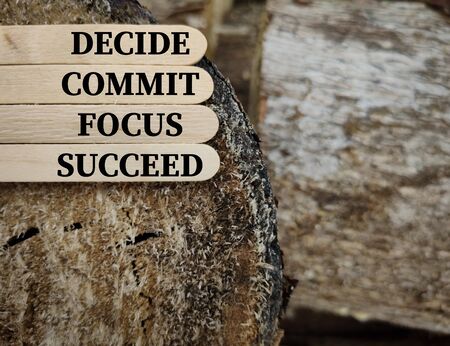 Inspirational and Motivational quote of DECIDE COMMIT FOCUS SUCCEED on wooden sticks.の写真素材