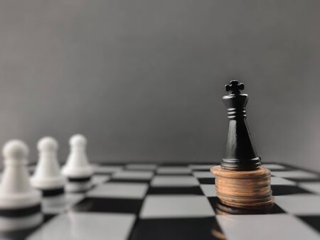 Black king chess piece in vintage background. Stock photo.の写真素材