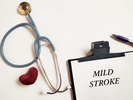 Healthcare concept. MILD STROKE text written on notepad. Stock photo.の写真素材