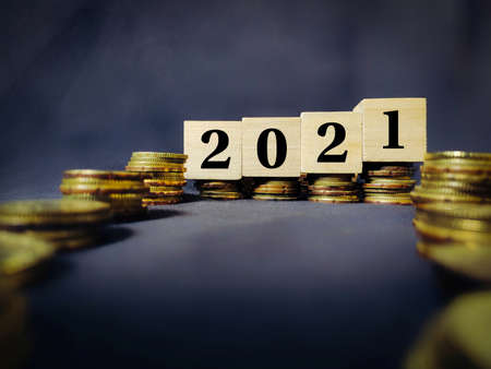 2021 number written on wooden blocks background. Business concept.の写真素材