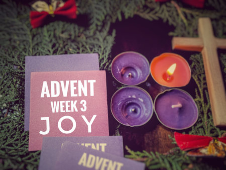 Advent calendar with candle and christmas tree on wooden background.の写真素材