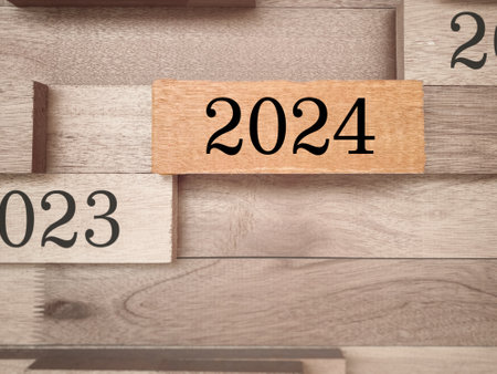 2024 text on wooden block background. New year concept.の写真素材